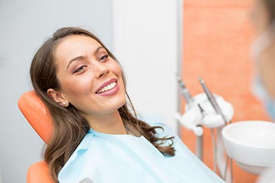 woman smiling in the dental chair at Northwest Natural Dentistry